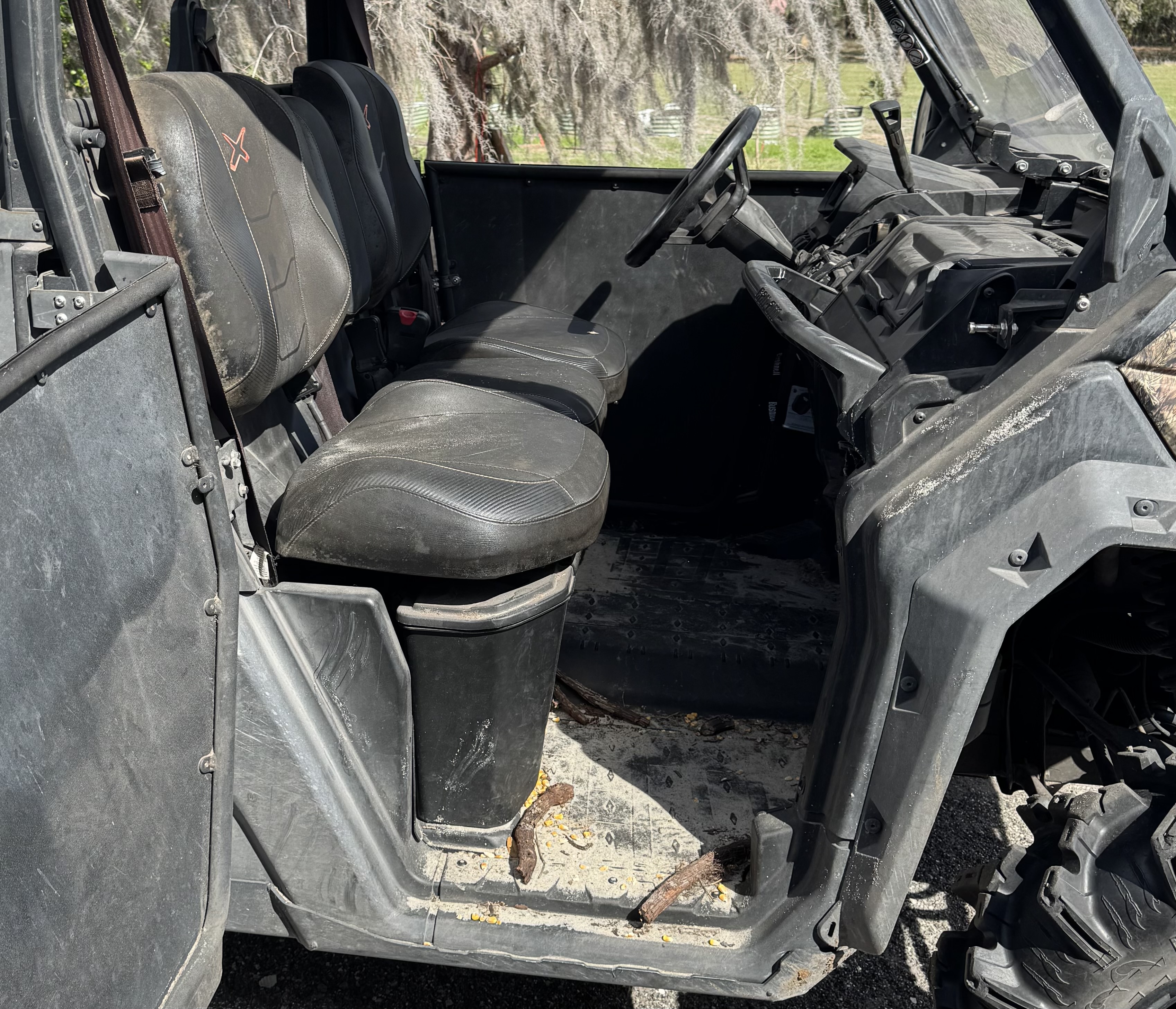 Can-Am Defender front seats before utility vehicle detailing