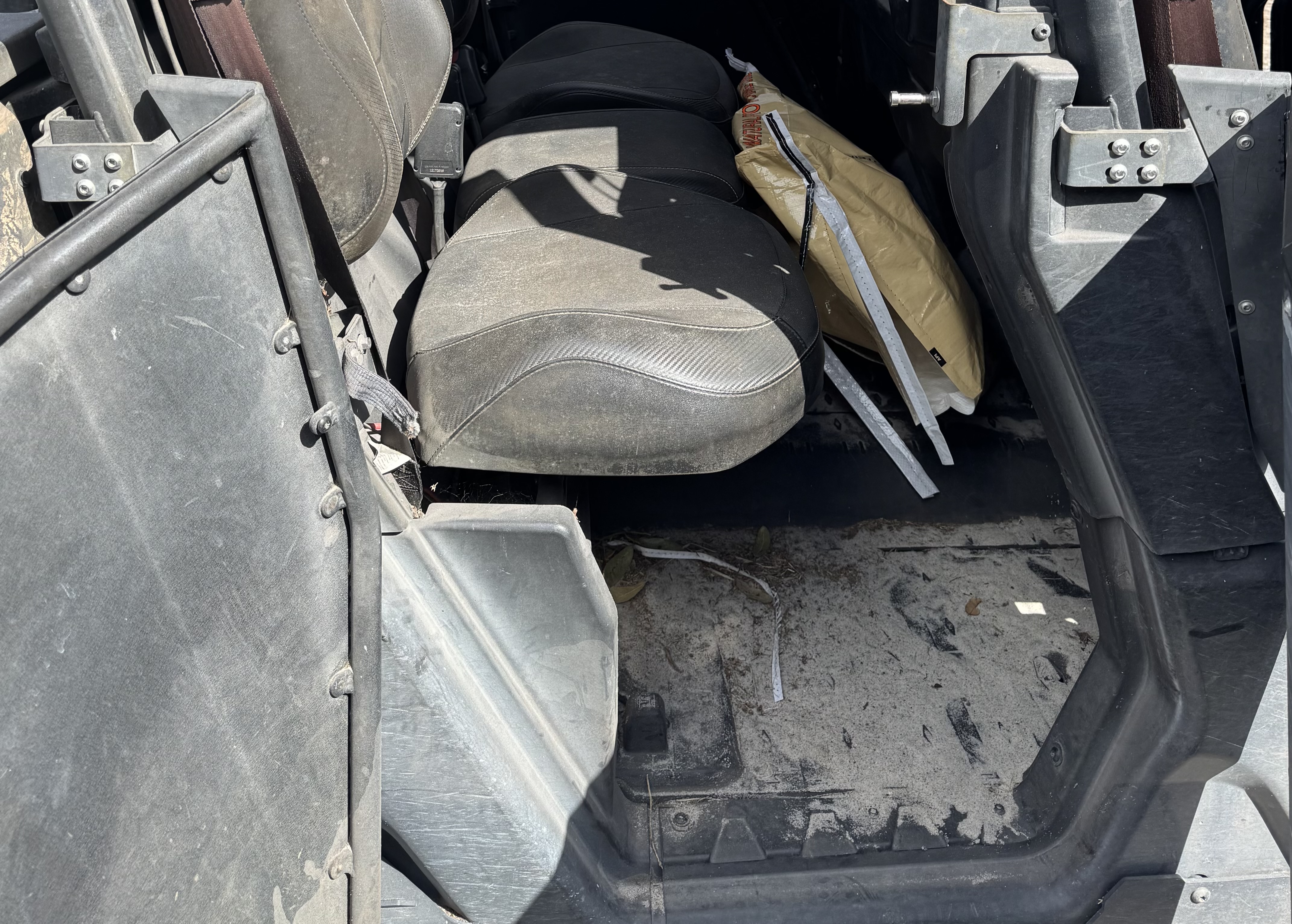 Can-Am Defender rear seating before utility vehicle cleanup