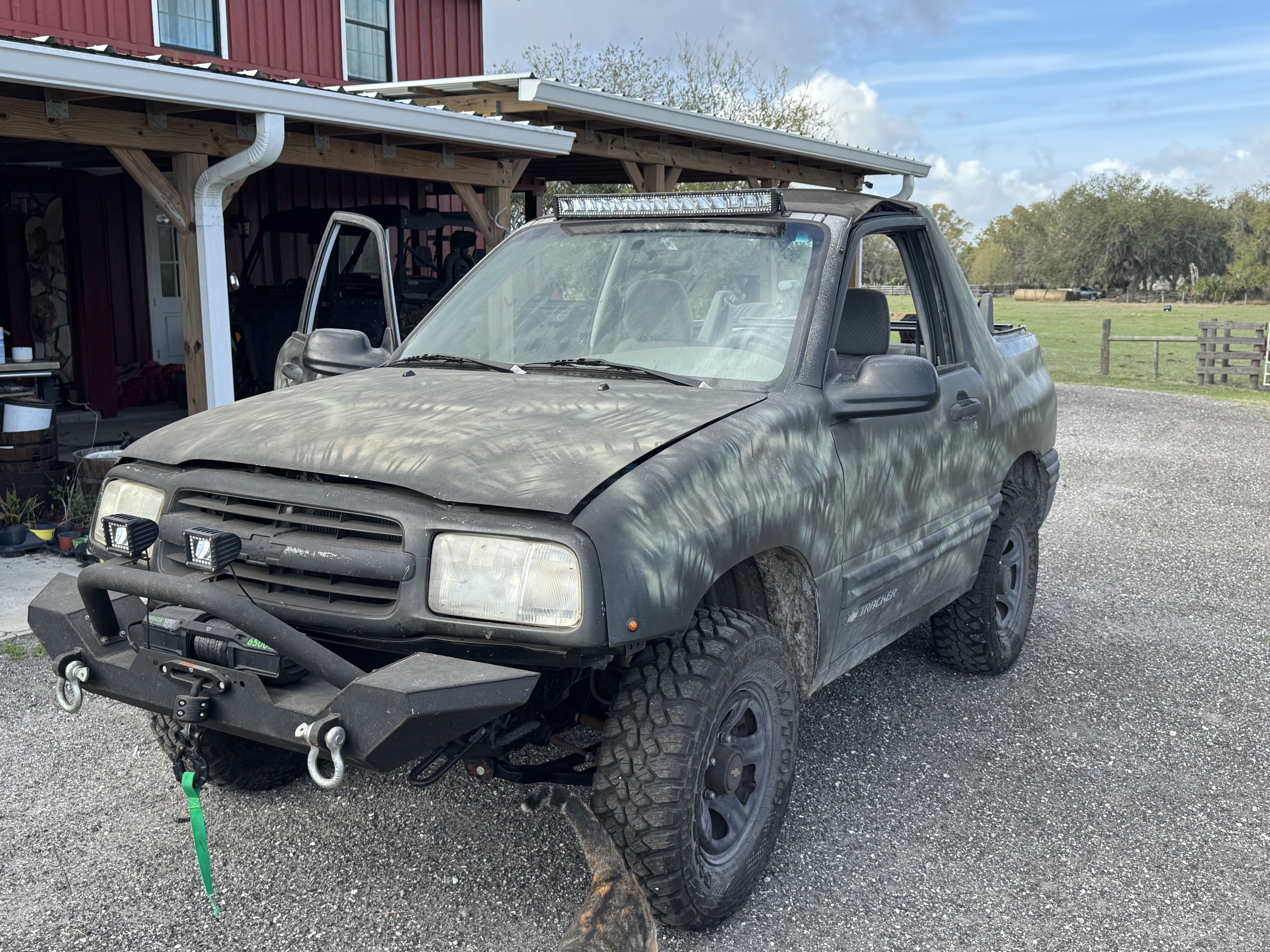 Suzuki Tracker before detailing service and wash